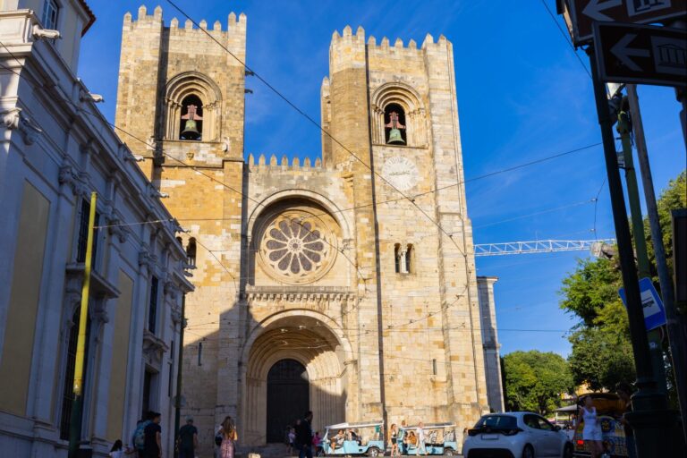 The twin bell towers of Lisbon Cathedral seen from a narrow street