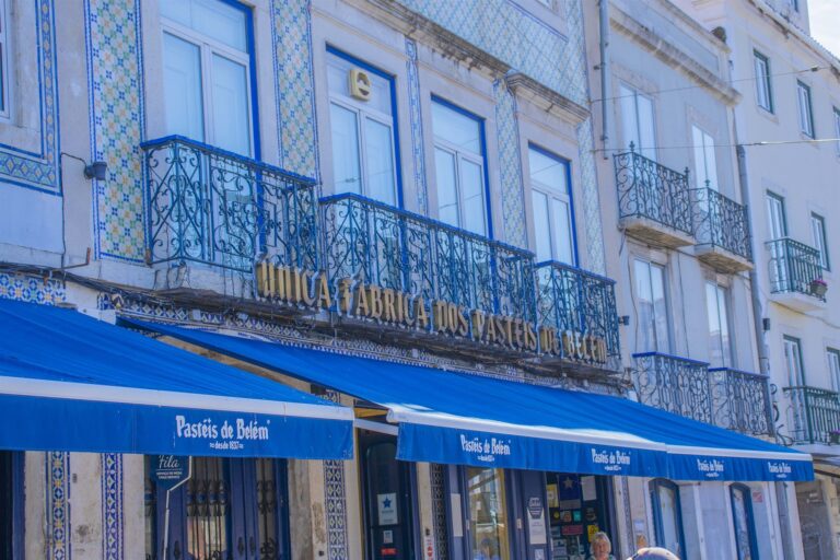 The blue-tiled shopfront of the Pasteis de Belem bakery in Lisbon