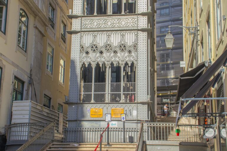 The wrought-iron Santa Justa Lift rising between buildings in central Lisbon