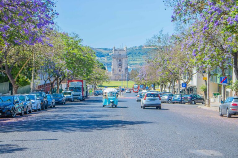 Tuk-tuk on a jacaranda-lined avenue in Belem