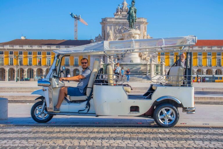 Tuk-tuk in an empty Praca do Comercio early in the morning