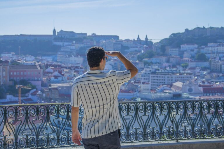 Guide looking out over Lisbon towards the castle